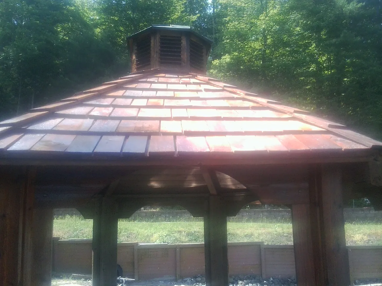 New cedar shake roof and cupola on a lakeside gazebo in Madison